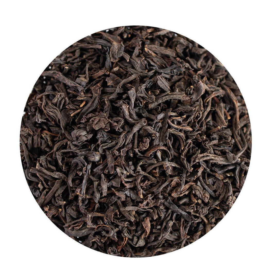 A close-up view of dried black tea leaves.