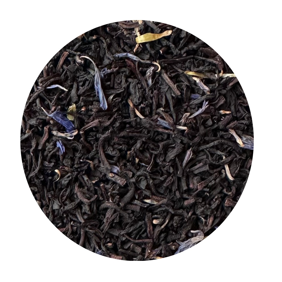 Black tea leaves with blue cornflower