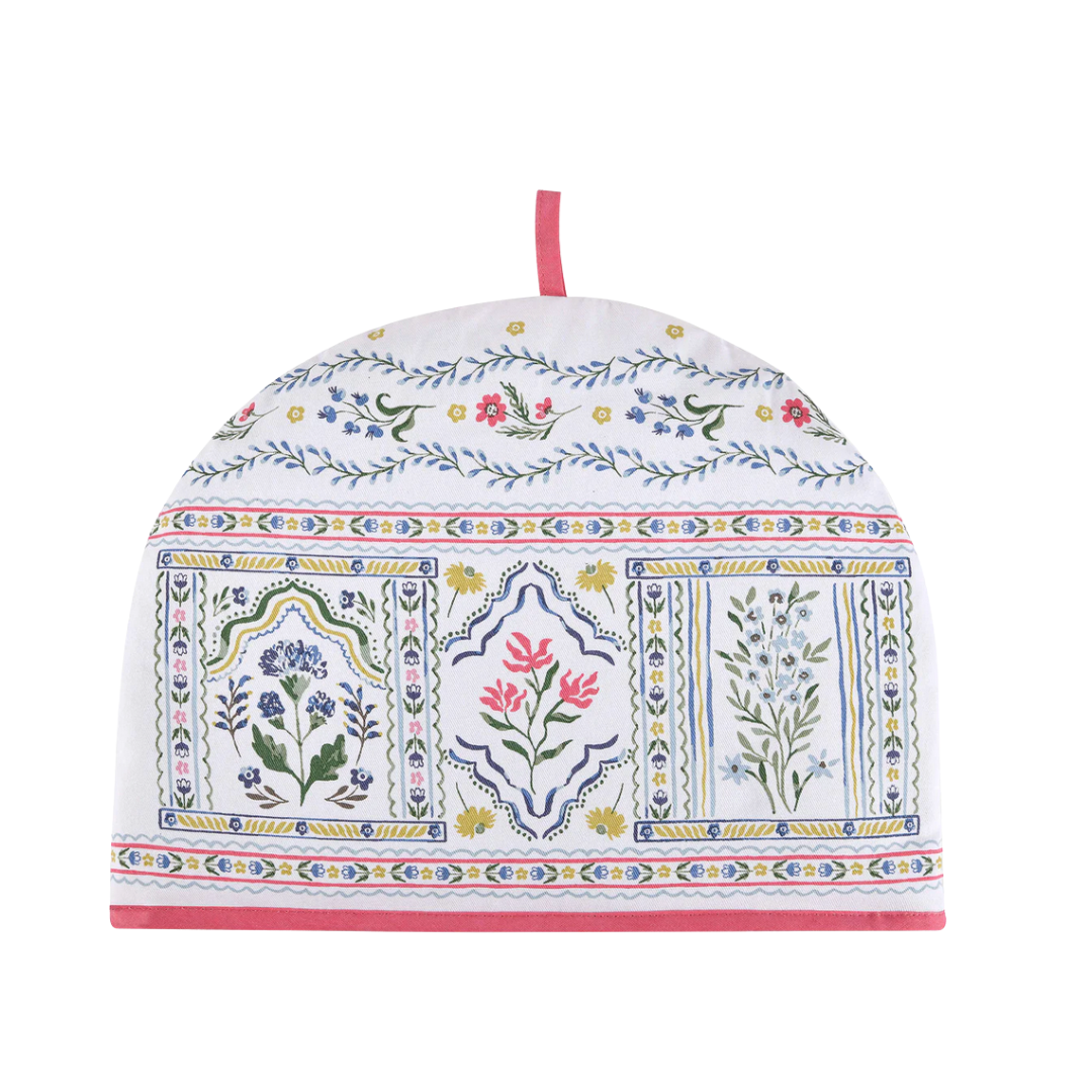 Decorative tea cozy with floral and geometric patterns on a white background