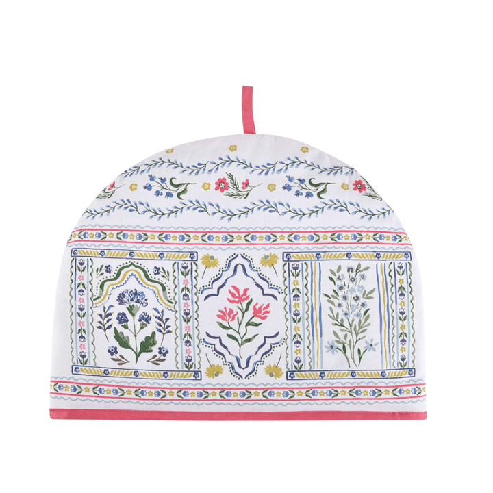 Decorative tea cozy with floral and geometric patterns on a white background