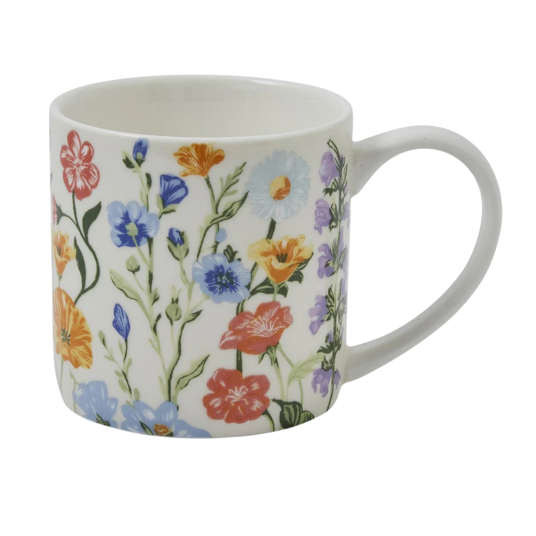 White bone china mug with colorful floral pattern on a white background