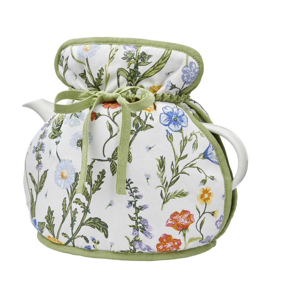 Tea pot cozy with floral patterned cover on a white background