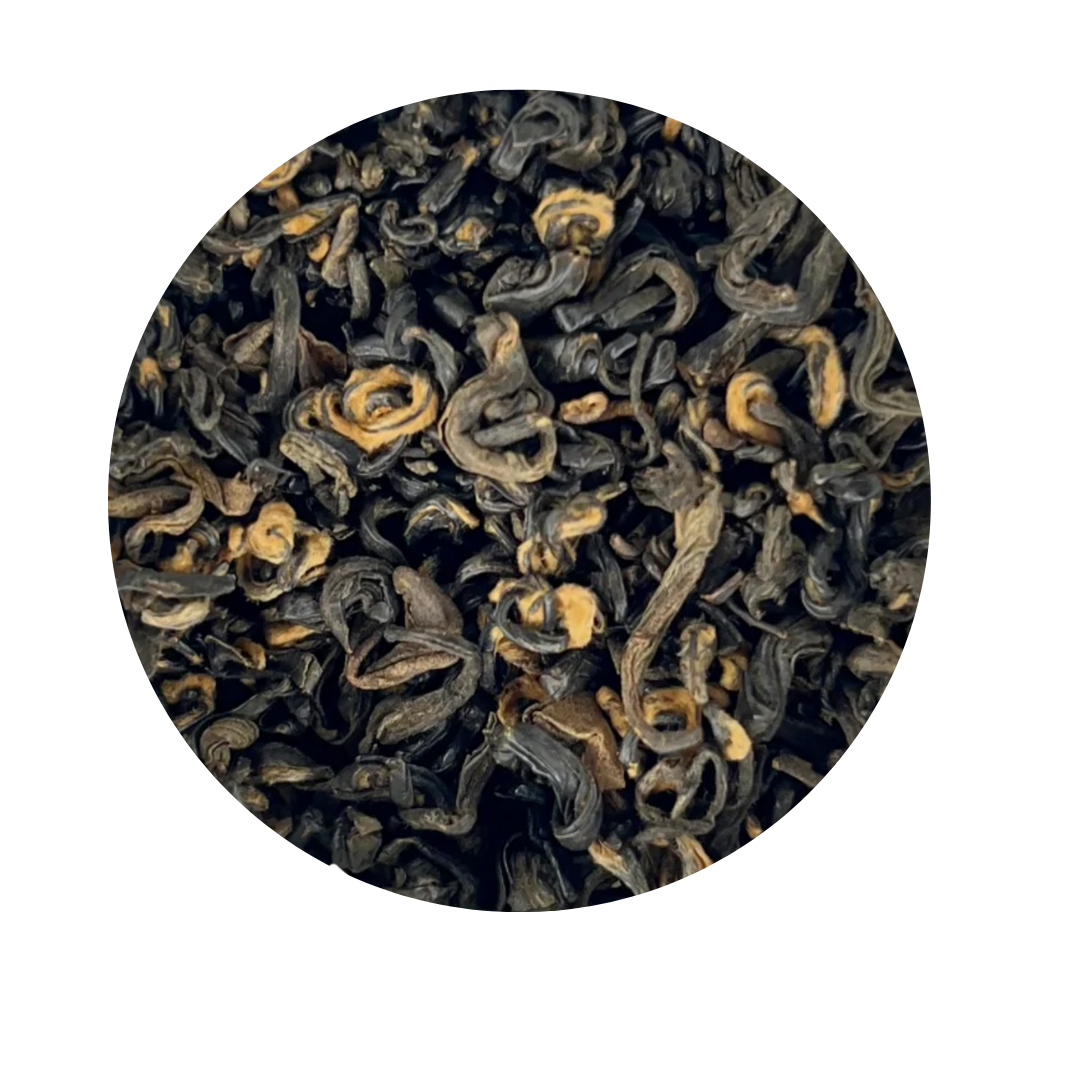 Close-up of black tea leaves on a white background