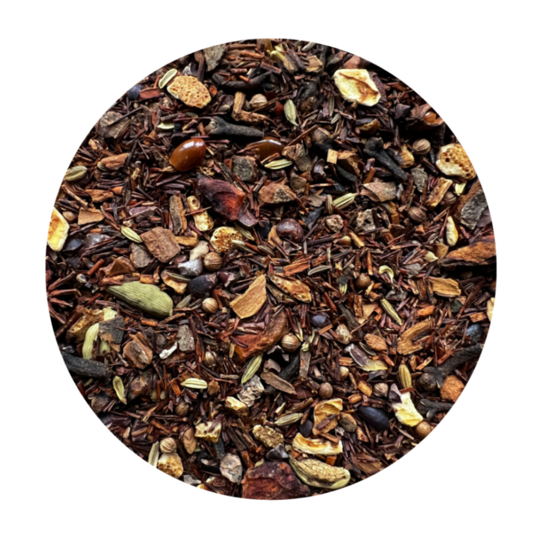 A mix of dried herbs and spices and rooibos on a white background