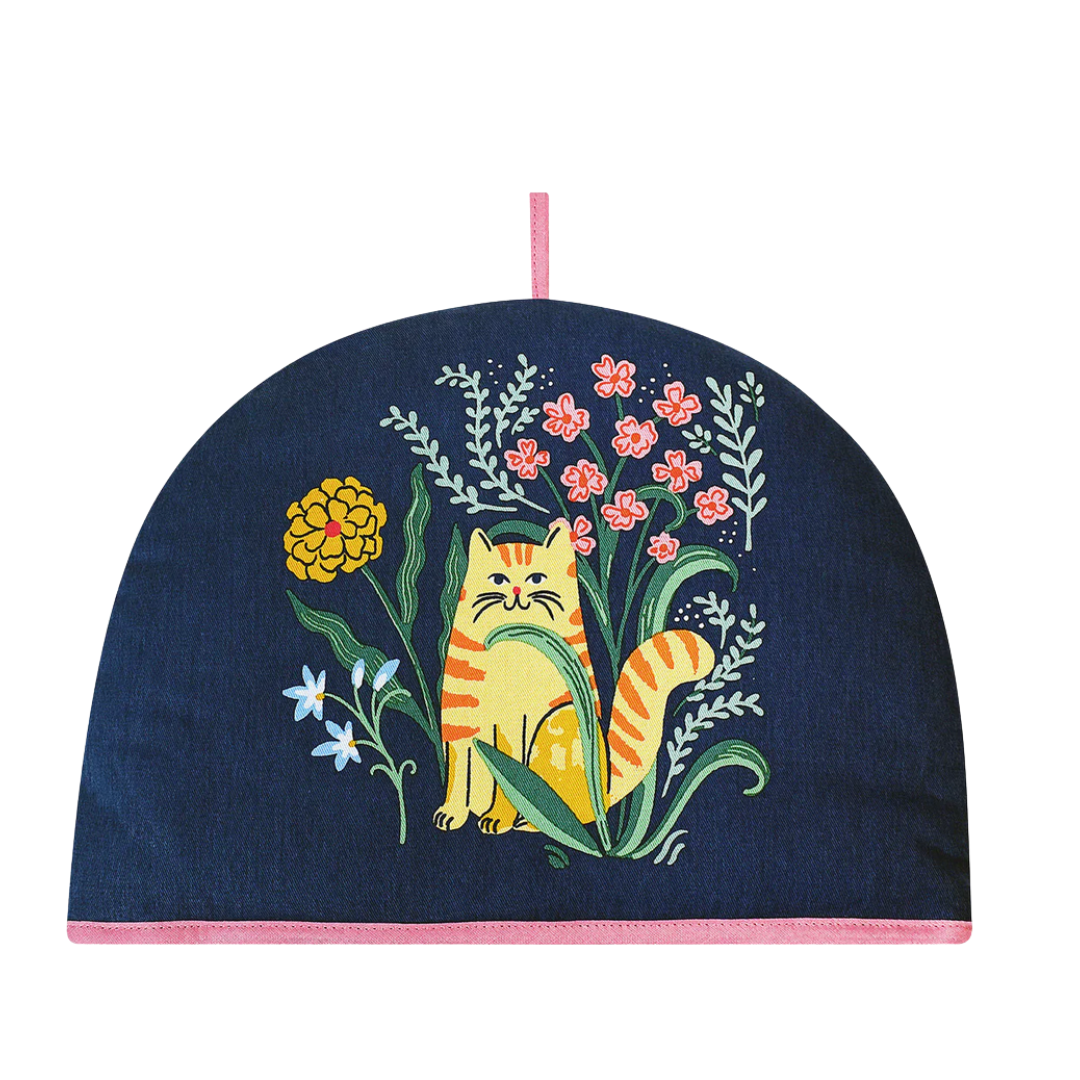 Tea cozy with a cat and floral design on a white background