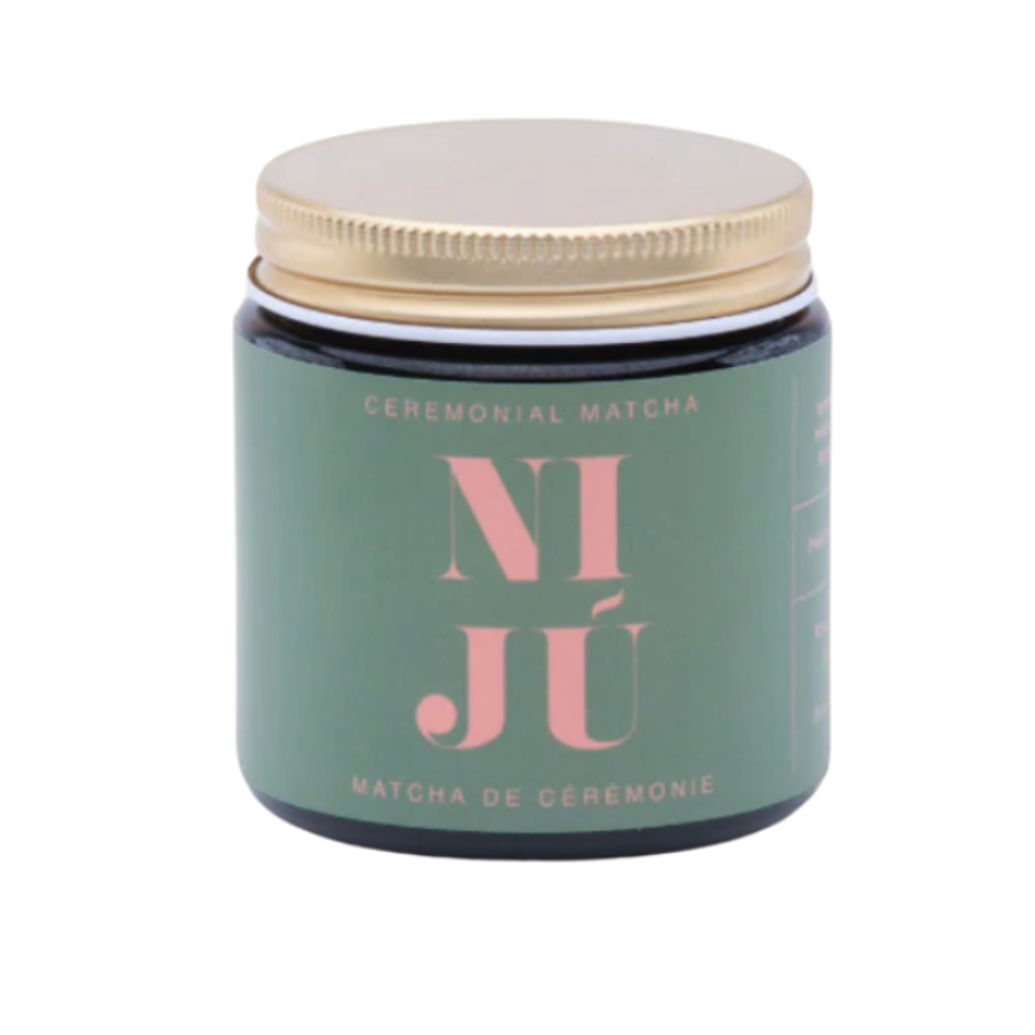 Green jar with gold lid labeled 'NI Jõ' on a white background
