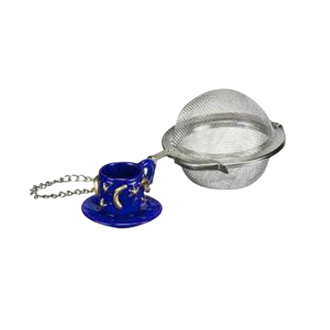 Mesh tea ball infuser with a blue teacup and saucer on a white background