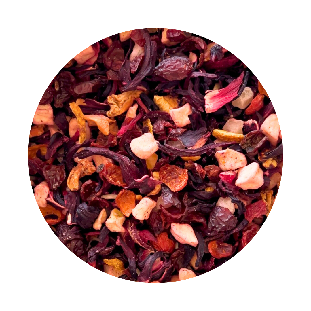 A mix of dried hibiscus, rose hips, apple pieces, candied pineapple cubes, orange peel, and coconut chips.