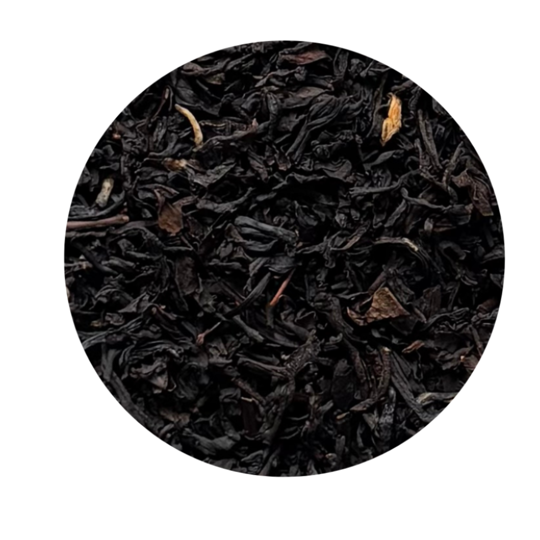  black tea leaves, with some small brown and tan botanical pieces visible