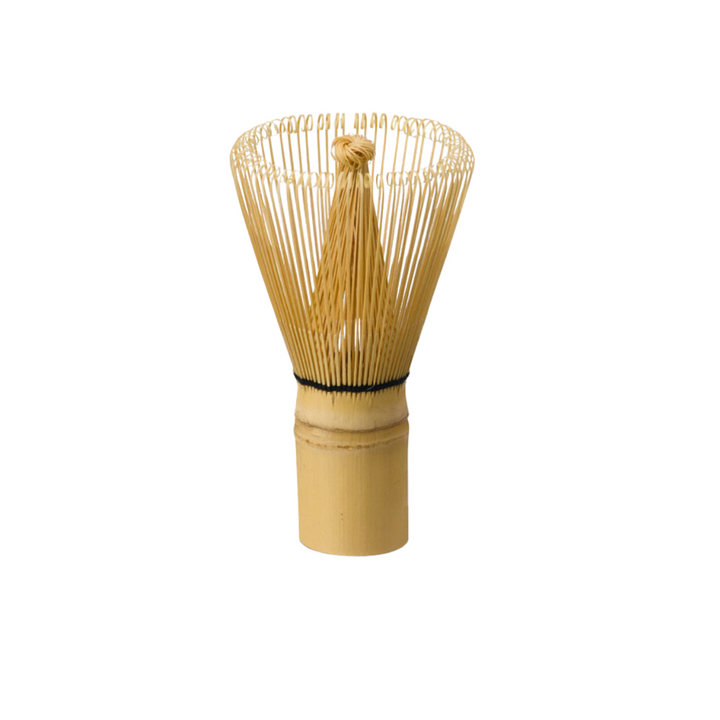 A traditional bamboo matcha whisk with numerous fine tines, used for preparing matcha tea.
