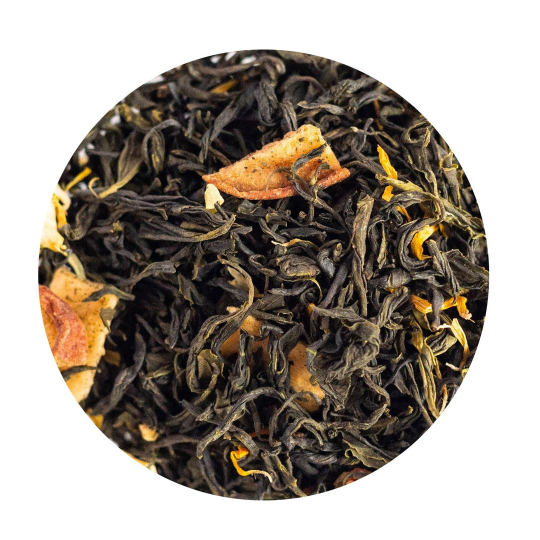 Organic Loose Leaf Green Tea with pieces of dried pear and calendula petals.